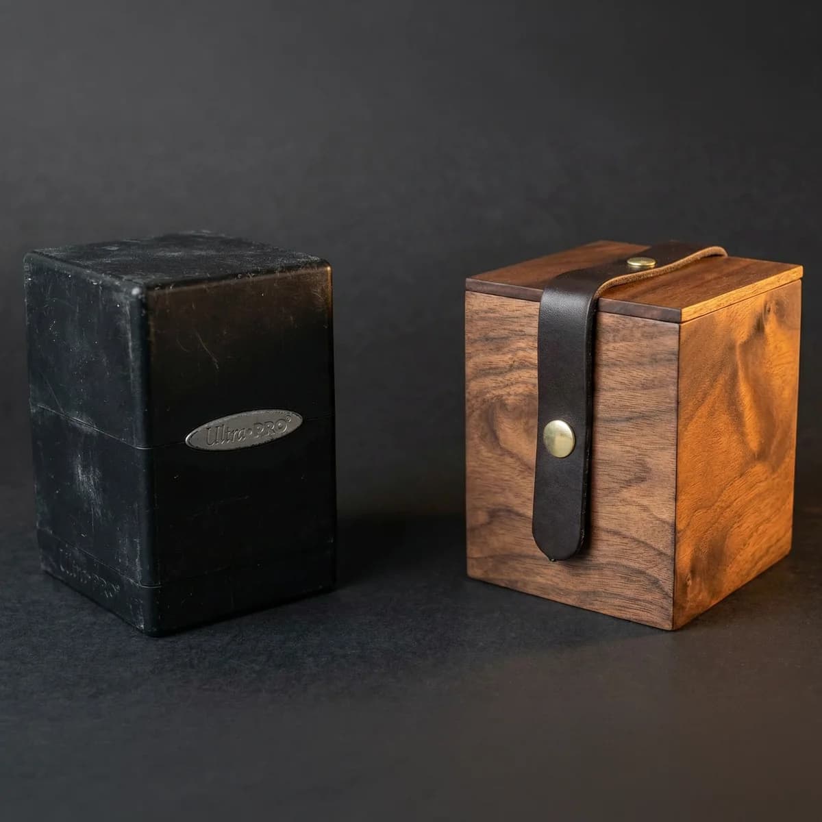 Comparison of a solid walnut wooden deck box versus a worn plastic deck box