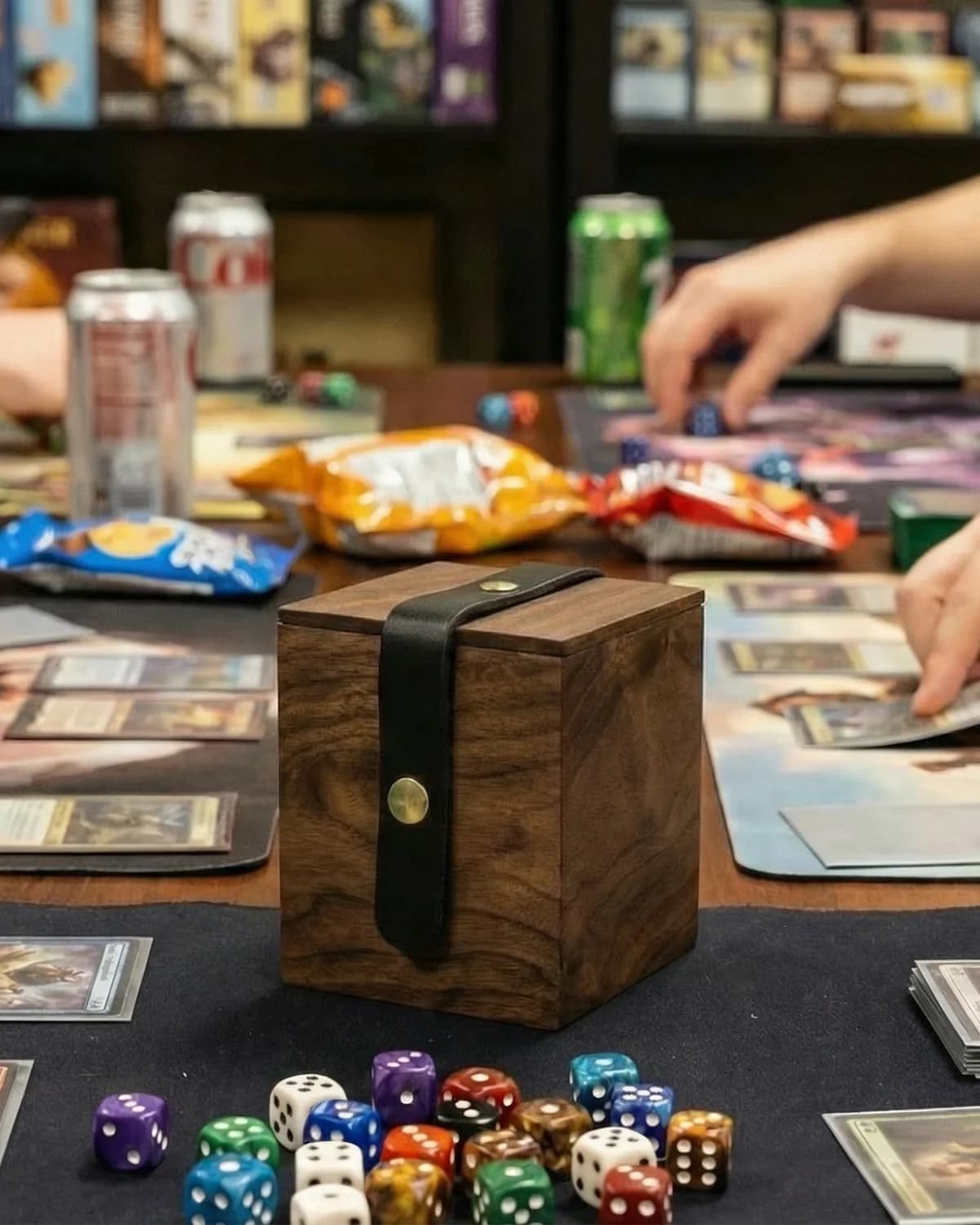 Handcrafted wooden deck box on a table during a Magic: The Gathering Commander game night